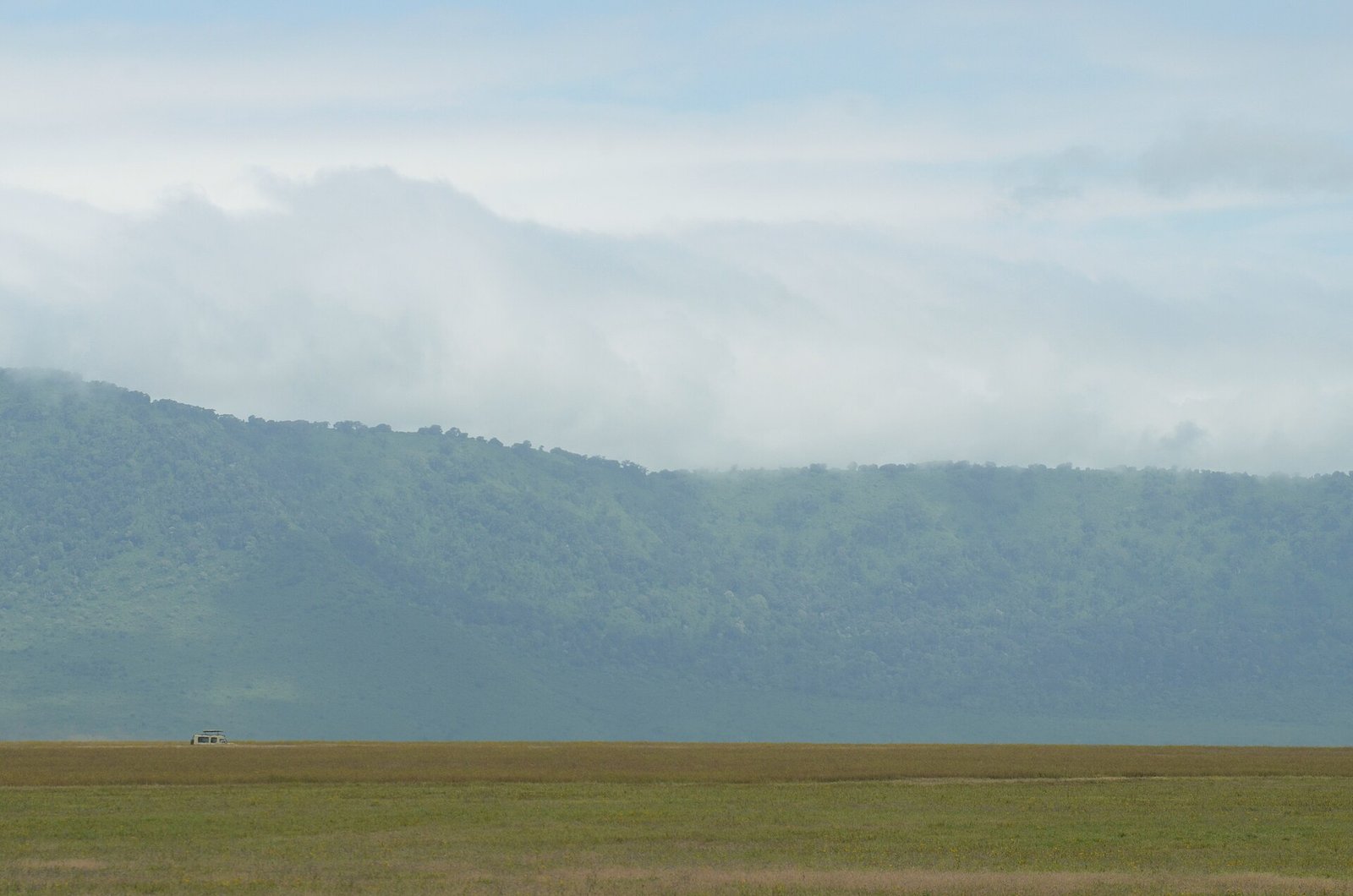 Safari vehicle on a game drive inside the Ngorongoro Crater