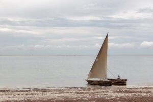 Traditional dhow sailing on turquoise water off Zanzibar
